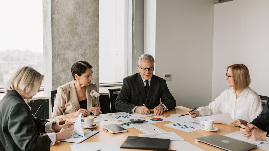 Business professionals in a meeting discussing transfer pricing